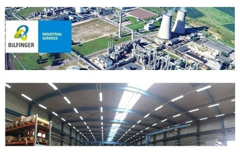 Hochmoderne Industriehalle mit LED-Hallenstrahlern für eine effiziente und langlebige Beleuchtung.