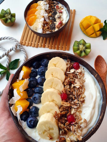 Yogurt bowl with mango, blue berries, banana's, granola, oats and dried cranberries!