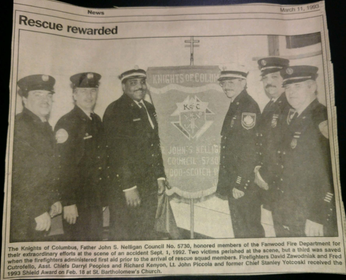 1993 photo and caption of Fanwood Firefighters receiving a reward for their actions from the Knights of Columbus.