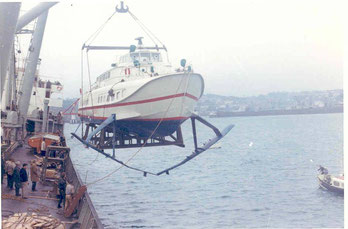 Condor 1 being lifted down from the ship which delievred her to Condor Limited.