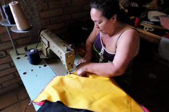 Seamstress Emma at work (Photo credits: Kate Stewart)