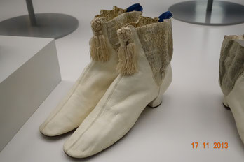 White victorian Victorian era shoes with frontal tassels, Otago Museum Dunedin, New Zealand. Photo: Epochs of Fashion