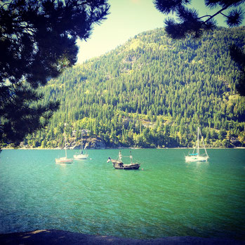 Reminds me about the book cover of Treasure Island. The small pirate boat in the Lake Kootaney.