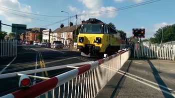 A freight train crossing London Road level crossing