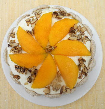 Sliced Mangos on a sponge cake