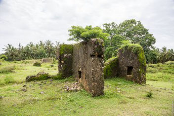 The walls are found halfway through the ruins area.  