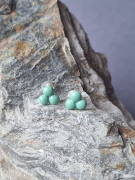 Drei kleine grüne Punkte