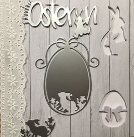 Karte "Frohe Ostern" mit österlichen Ausstanzungen, heller Spitze auf Holzdekor