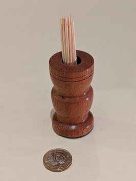 112.  Hardwood toothpick holder.