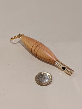 119. Hand-turned wood and gilt whistle.