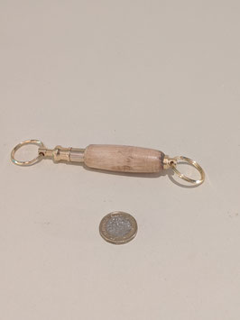 34. Double ended gilt and wood keyring