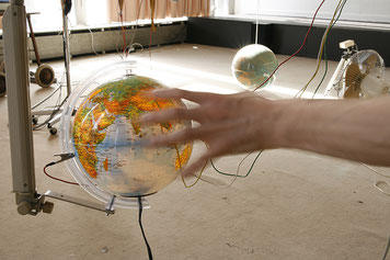 People can touch some objects. These actions change the synthesized images and generate sounds.
