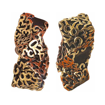 Paolo Grassi Melodie sculpture, two intertwined bronze vertical shapes with numerical patterns