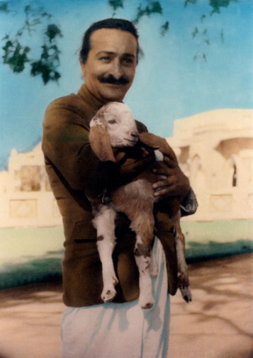 Meher Baba with kid goat in Alwar village, India - 1940. Colourized photo