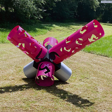Contemporary sculpture by Paolo Grassi with magenta and grey cylinders, featuring numerical cut-outs.