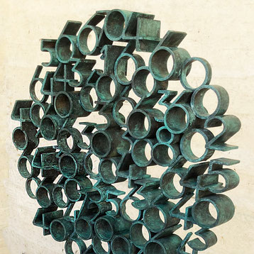Tobia by Paolo Grassi, large circular bronze sculpture with protruding cylindrical numeric elements