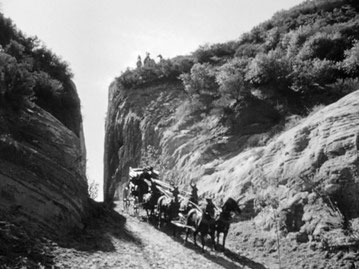 In the classic John Wayne film, the "Stagecoach" travels through Beale's Cut in Newhall. At the time of filming in 1938, the Sierra Highway was the main roadway from Los Angeles to Newhall.  