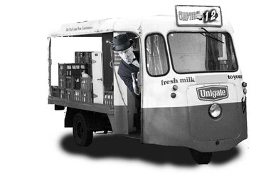 Photo of typical British culture: Vintage English milk float from around 1980. Used to deliver milk to people's doorstep. 