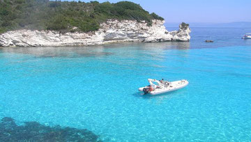 A natural bay in Paxos with emeral green sea