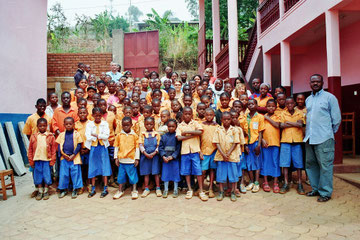 Group photo with the children, Innocent Djonthe and staff