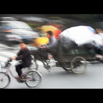 BUSY BEIJING (People of Beijing with their various modes of transportation bustling to work)