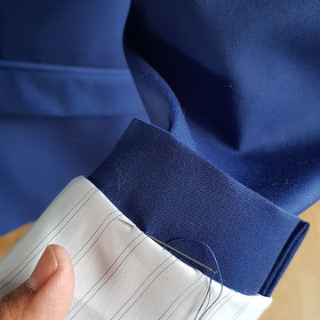 Couture  reprise manches veste homme