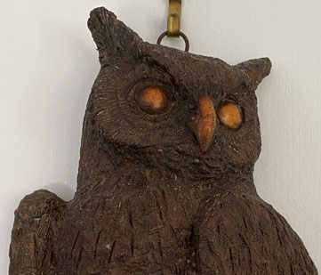 A finely carved wall hanging owl
