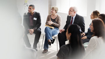 Businessmenschen in einer Gruppensitzung