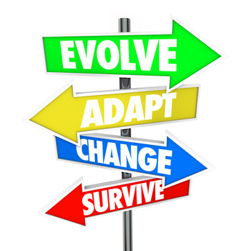 four Arrows on a signpost with the words "Evolve", "Adapt",  "Change", and "Survive". 