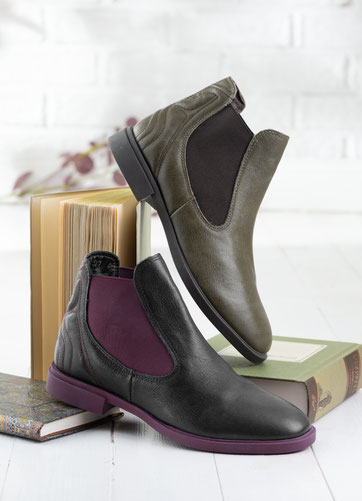 Stiefelette in Form eines Chelea-boot in der Farbe olive mit schwarzer sohle und dunkelbraunem Gummizugeinsatz und schwarze Stiefelette mit lila Gummizug und  Sohle