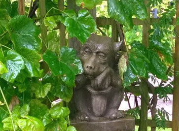 Glum gargoyle in the rain (but maybe he just looks glum because he doesn't have a book?)