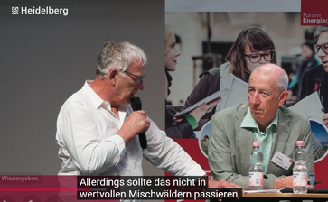 Bild: Aus dem Video der Stadt Heidelberg: A. Kellner mit Dr. Ch. Ewen (rechts).