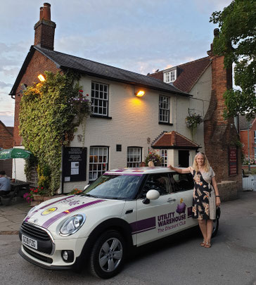 Karen Potton with her mini branded with her business logo outside The Swan Pub, Wheathampstead. Karen Potton saves her customers money on their bills and gives them money back while they spend!
