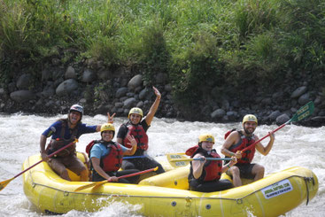Visitors enjoying the Arenal Combo Tour with canopy ziplining over the rainforest and white-water rafting on the Balsa River near Arenal Volcano, Costa Rica.