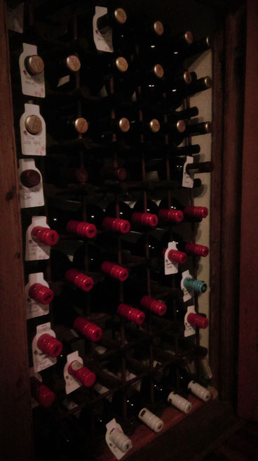 Close-up of the red wine storage, refilled. Bottles of wine, old. South Africa.