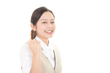 ガッツポーズをする女性会社員