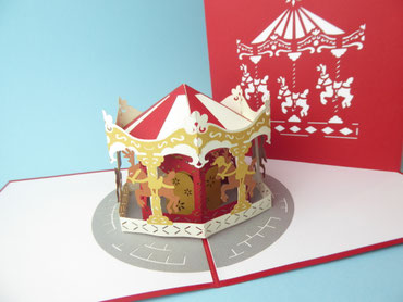 Carte pop-up manège de noël avec des petits rennes