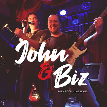 John & Biz playing guitar