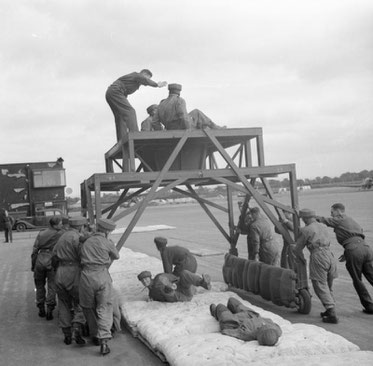 Men of the 6th training jumping through the hole