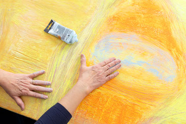 Photo of Birgits hands painting by Chris Gebhart