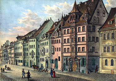 Die Adlerstraße in Nürnberg. Im Hintergrund links: der Gasthof "Zum Goldenen Adler". Lithografie von F. Scharrer. 1840.