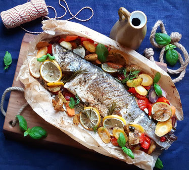 Oven baked Sea bass with potatoes, vegetables and herbs like rosemary, dill, sage, basil ! 