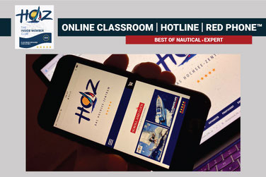Smartphone mit HOZ-Website – RED PHONE™ bietet 24/7 persönlichen Support durch HOZ Coaches für Hochseeschein-Lernende.