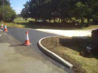 And the site now has a proper "Highways Standard" entrance - with tarmac & curbs