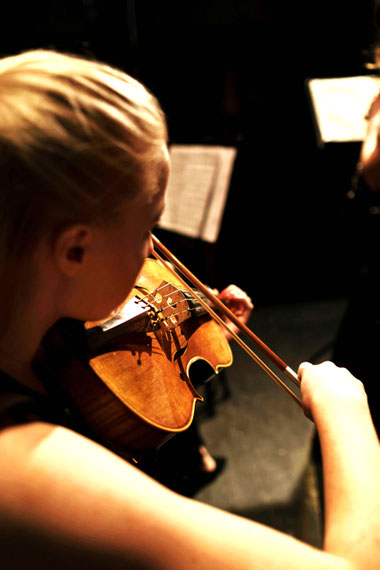 Young woman playing violin