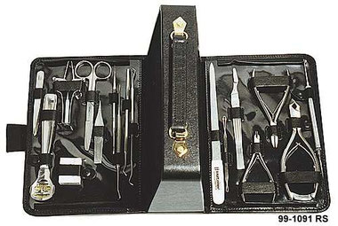 Picture shows the opened black Leather Case filled with  stainless-steel  Scissors, Manicure und Pedicure Instruments