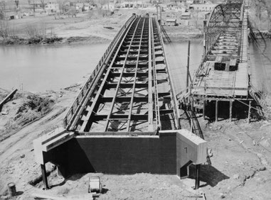 Low level aerial view looking west with the old bridge on the right, 23 April 1949 