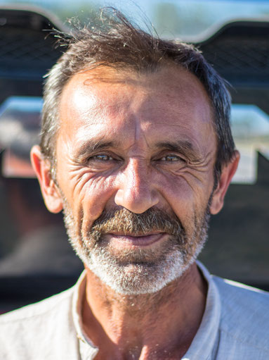 Truck driver Akif in front of his MAN truck