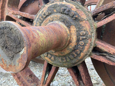 Stamp detailing with the wording "Gloucester Wagon Company 1875" embossed around the axle