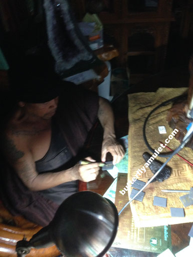 Kruba Krissana signing amulets